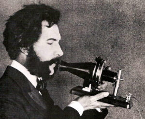 1876 bell speaking into telephone