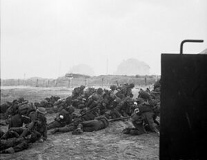 infantry waiting to move off 'queen white' beach